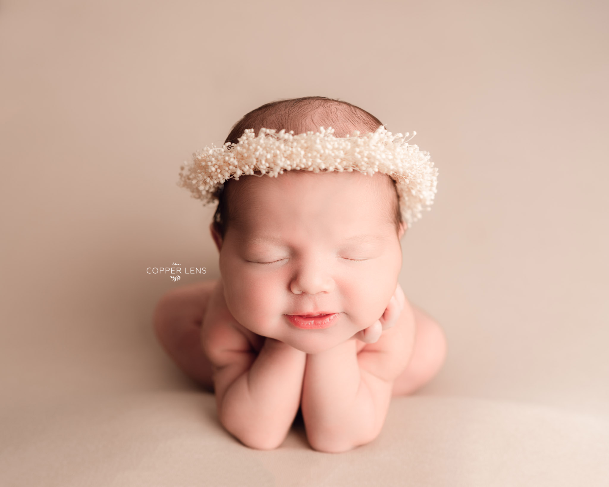 baby smiling at newborn photoshoot in Swansea 