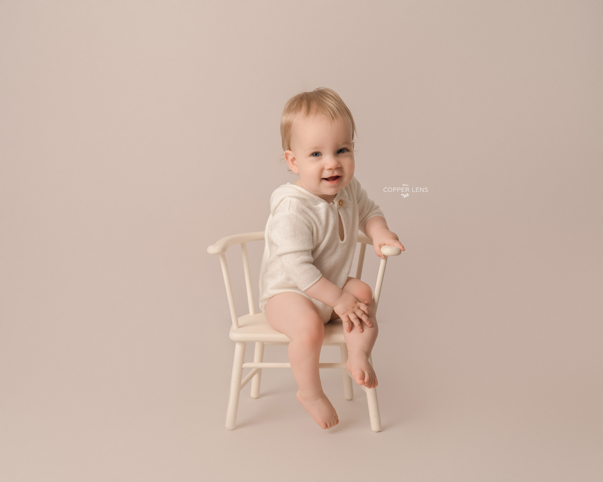 baby boy sitting on chair during swansea photoshoot