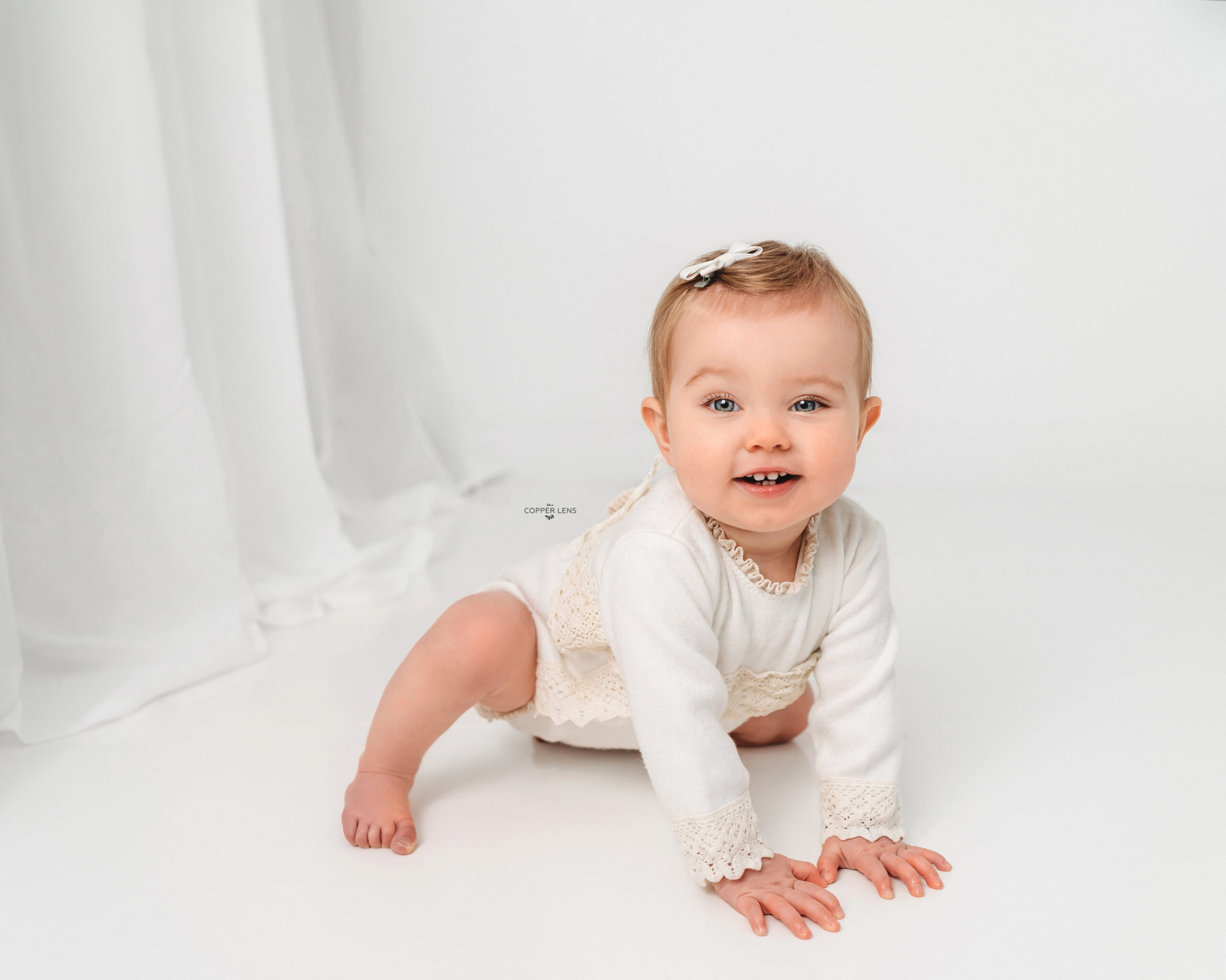 little girl in white during baby photoshoot swansea