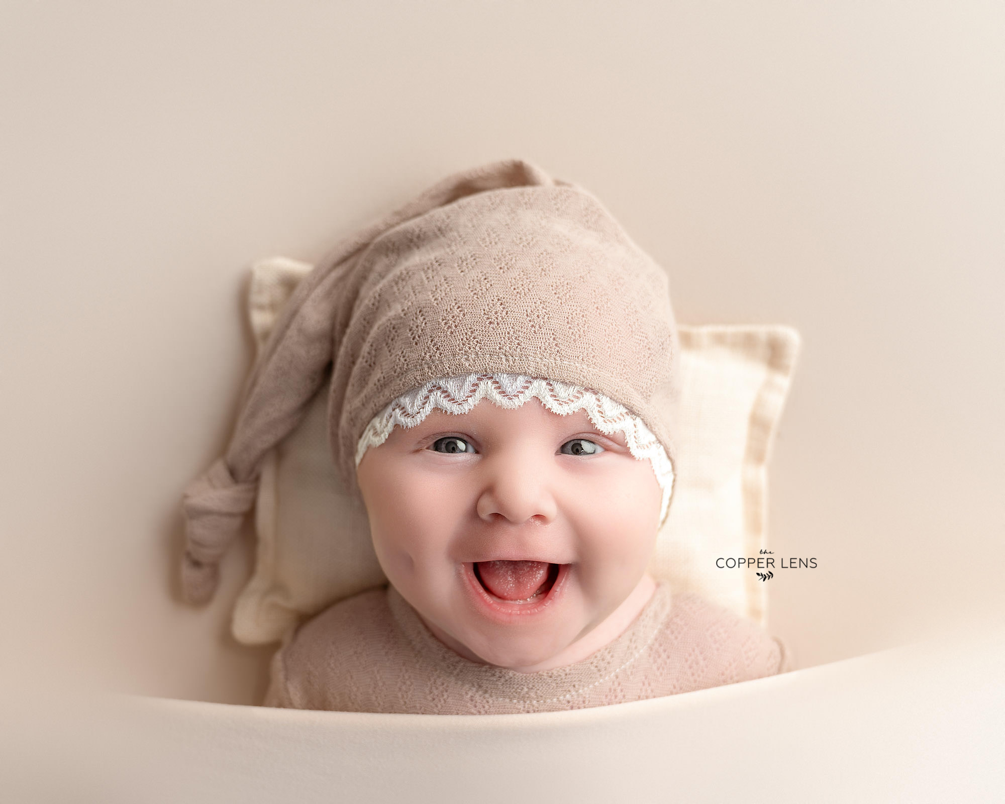 newborn baby smiling during photoshoot in swansea